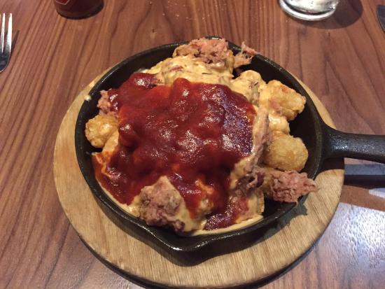 Whisky River signature dishes Dirty Tots
Texas Tequila Bacon Cheddar Burger
Pulled Pork Sandwich